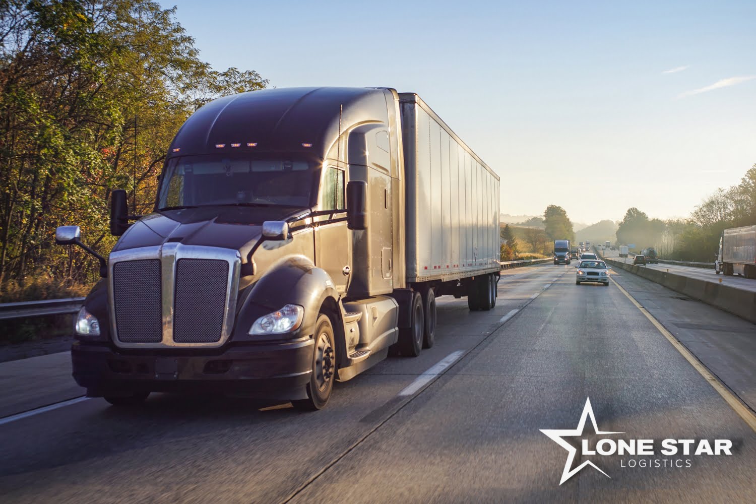 semi truck transporting goods over the road with the Lone Star Logistics logo stamped in the corner
